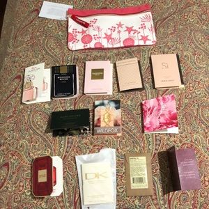 12 perfume samples with Clarins pouch